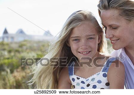 Girl with her mother View Large Photo Image Stock Photo - Girl with her mother. Fotosearch