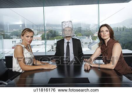 Guy with a bin on his head, two women View Large Photo Image Stock Photograph - Guy with a bin on his head, two women. Fotosearch