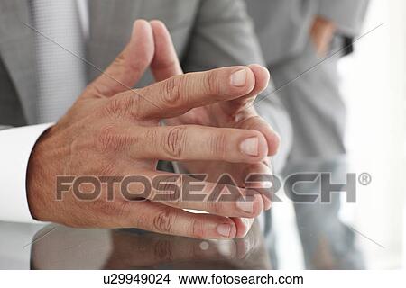 Picture - Hands of a mature businessman. Fotosearch