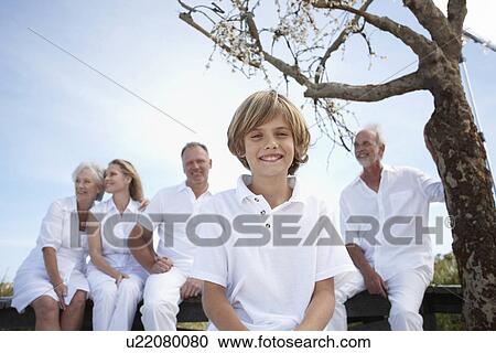 Happy boy with his family View Large Photo Image Stock Image - Happy boy with his family. Fotosearch