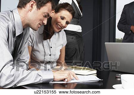Stock Photography - Happy business people at work. Fotosearch
