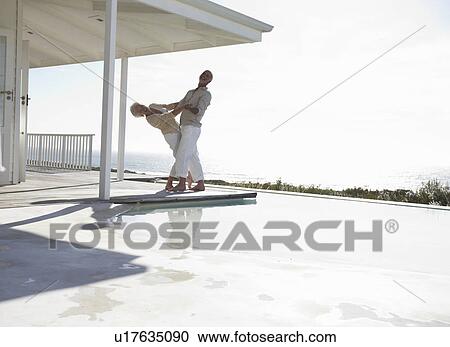 Stock Image - Happy couple dancing. Fotosearch