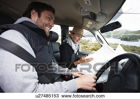 Happy couple in their car View Large Photo Image Stock Image - Happy couple in their car. Fotosearch