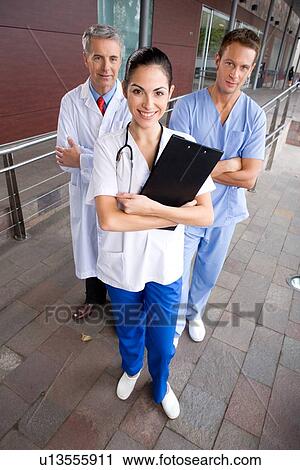 Stock Image - Happy doctors team. Fotosearch