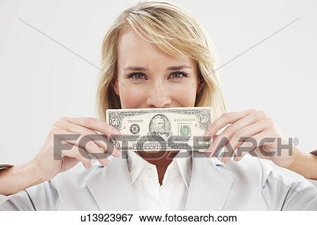 Happy girl with a banknote View Large Photo Image Stock Photo - Happy girl with a banknote. Fotosearch