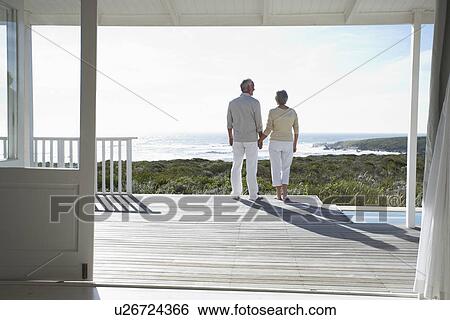 Stock Photograph - Happy looking at the sea. Fotosearch