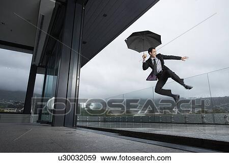 Happy man in the rain View Large Photo Image Stock Photo - Happy man in the rain. Fotosearch
