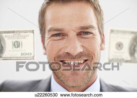 Stock Image - Happy man with dollar notes. Fotosearch
