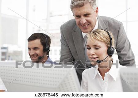 Happy people at work View Large Photo Image Stock Image - Happy people at work. Fotosearch - Search Stock Photos, Mural Pictures, Photographs, and Photo Clipart