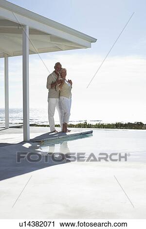 Happy seniors at their house View Large Photo Image Stock Image - Happy seniors at their house. Fotosearch