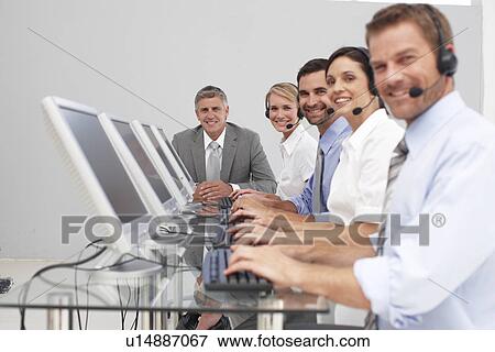 Happy team at work View Large Photo Image Stock Photo - Happy team at work. Fotosearch