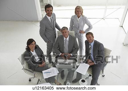 Happy team looking to the camera View Large Photo Image Stock Photography - Happy team looking to the camera. Fotosearch