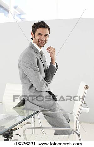 Stock Image - Happy young businessman. Fotosearch
