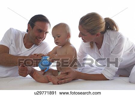 Stock Image - Happy young family. Fotosearch