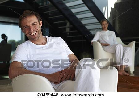 Stock Photograph - Happy young man with his girlfriend. Fotosearch