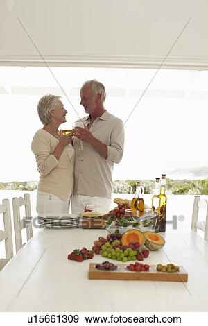 Stock Photo - Having an aperitif before lunch. Fotosearch