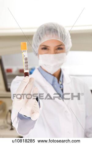 Stock Photography - Holding a tube. Fotosearch
