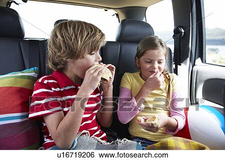 Kids eating fast food View Large Photo Image Stock Photograph - Kids eating fast food. Fotosearch