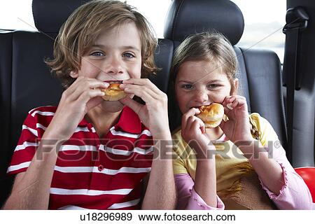 Stock Photo - Kids having a snack. Fotosearch