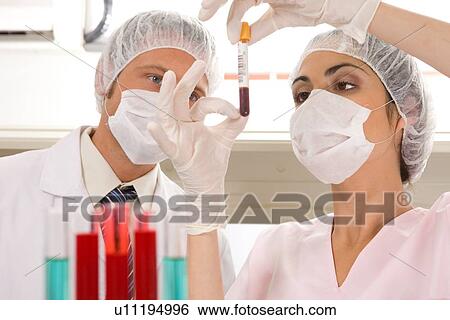 Laboratory technicians at work View Large Photo Image Stock Photograph - Laboratory technicians at work. Fotosearch