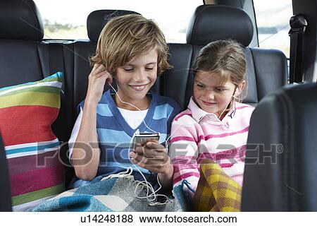 Listening to music View Large Photo Image Stock Photo - Listening to music. Fotosearch