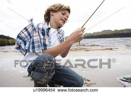 Picture - Little fisherman. Fotosearch