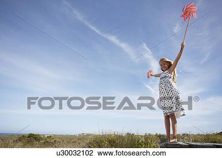 Stock Image - Little girl in the fields. Fotosearch