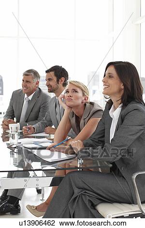 Stock Image - Making funny face at a meeting. Fotosearch