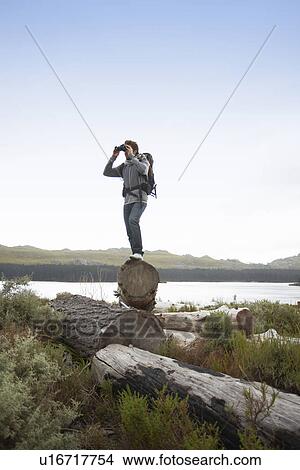 Picture - Man hiking in the countryside. Fotosearch