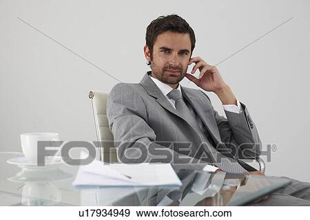 Man in his office View Large Photo Image Stock Photo - Man in his office. Fotosearch