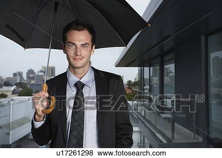 Man in the rain View Large Photo Image Stock Photo - Man in the rain. Fotosearch