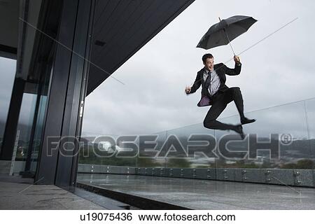 Stock Photograph - Man in the rain. Fotosearch