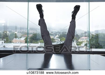 Man legs in the office View Large Photo Image Stock Photo - Man legs in the office. Fotosearch