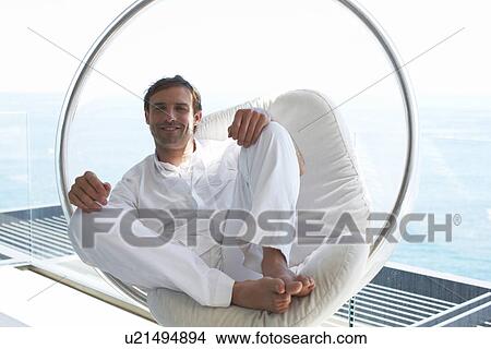 Picture - Man relaxing. Fotosearch