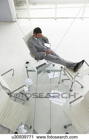 Man with a laptop and mobile phone View Large Photo Image Stock Image - Man with a laptop and mobile phone. Fotosearch