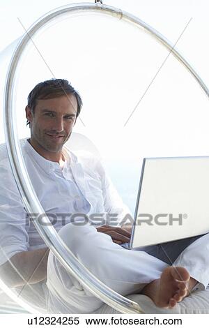 Stock Photography - Man with a laptop. Fotosearch