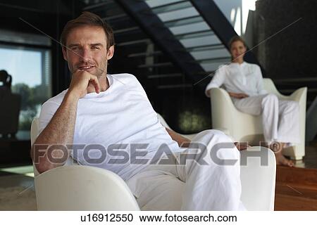 Stock Image - Man with a woman in the background. Fotosearch
