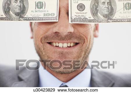Stock Photo - Man with dollar notes. Fotosearch