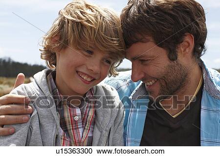 Stock Image - Man with his son. Fotosearch