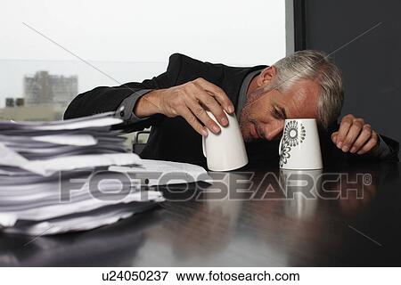 Mature businessman playing with cups View Large Photo Image Stock Photo - Mature businessman playing with cups. Fotosearch