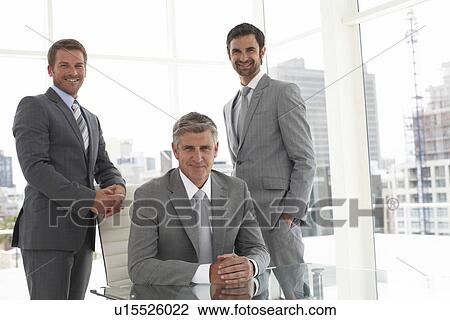 Mature businessman with his team View Large Photo Image Stock Image - Mature businessman with his team. Fotosearch