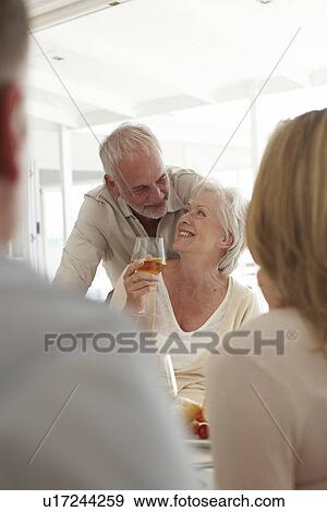 Mature couple celebrating View Large Photo Image Stock Photo - Mature couple celebrating. Fotosearch