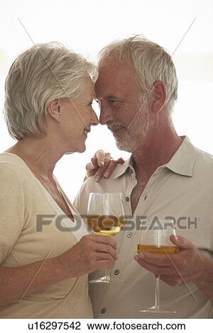 Mature couple drinking wine View Large Photo Image Stock Image - Mature couple drinking wine. Fotosearch