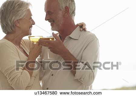 Stock Image - Mature couple having fun. Fotosearch