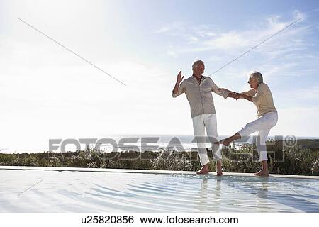 Mature couple having fun View Large Photo Image Stock Photograph - Mature couple having fun. Fotosearch