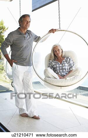 Mature couple in a luxurious house View Large Photo Image Stock Image - Mature couple in a luxurious house. Fotosearch