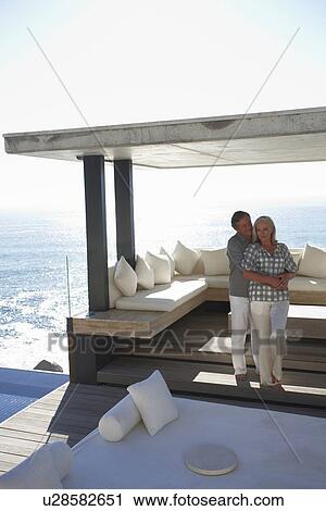Mature couple in their house View Large Photo Image Stock Image - Mature couple in their house. Fotosearch
