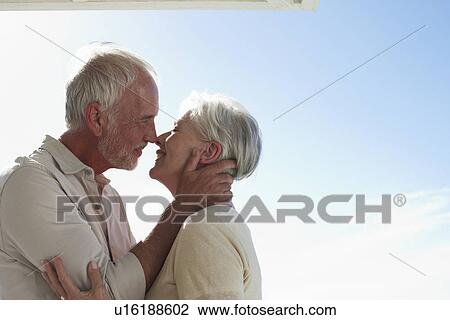 Mature couple kissing View Large Photo Image Stock Image - Mature couple kissing. Fotosearch