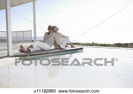 Mature couple relaxing View Large Photo Image Stock Image - Mature couple relaxing. Fotosearch