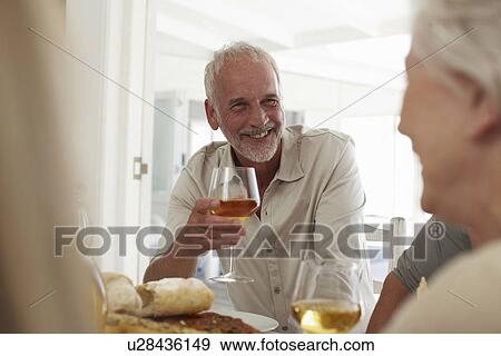 Mature man drinking wine View Large Photo Image Stock Photo - Mature man drinking wine. Fotosearch